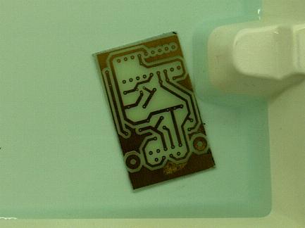 The etching solution colors slighty blue